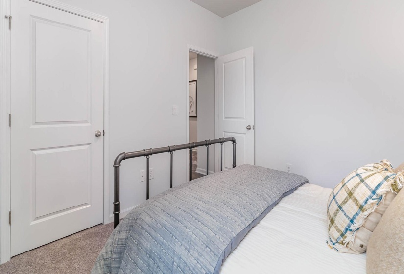 Bedroom with light carpet