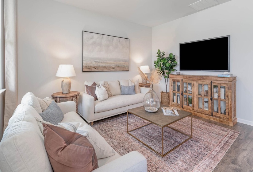 Living room featuring wood finished floors and baseboards