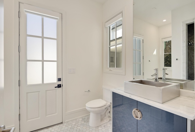 Bathroom with vanity and a shower