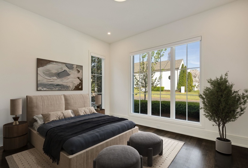 Bedroom with dark wood-style floors and recessed lighting