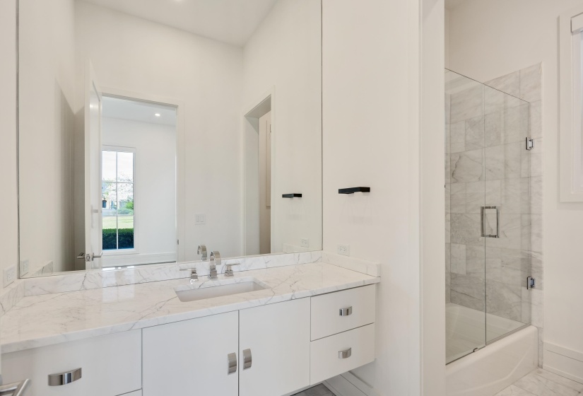 Bathroom with vanity and baseboards