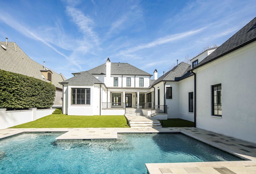 Back of house with a patio, stucco siding, and a yard