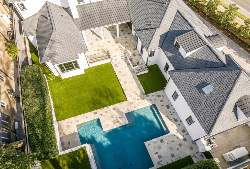 Aerial view of property and surrounding area with a pool