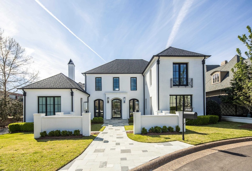 French country home featuring stucco siding and french doors