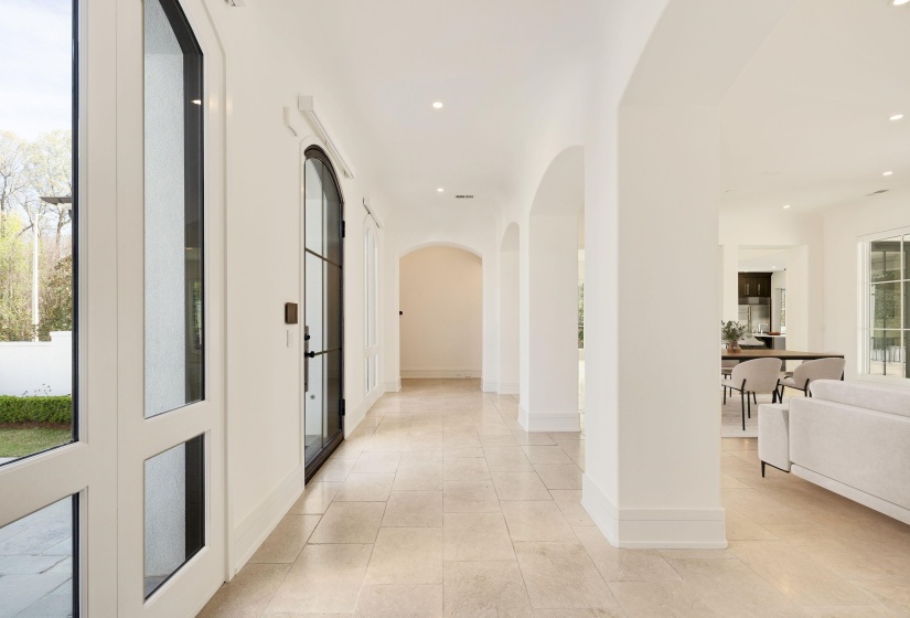 Hall with arched walkways and recessed lighting