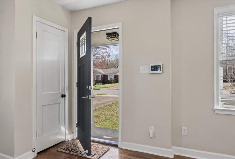 Foyer entrance with dark wood-style floors