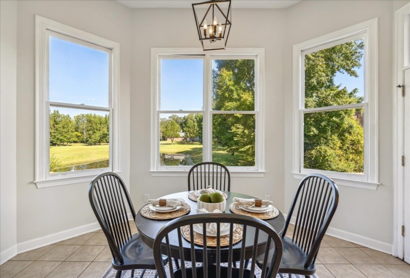 Tiled dining space with a notable chandelier