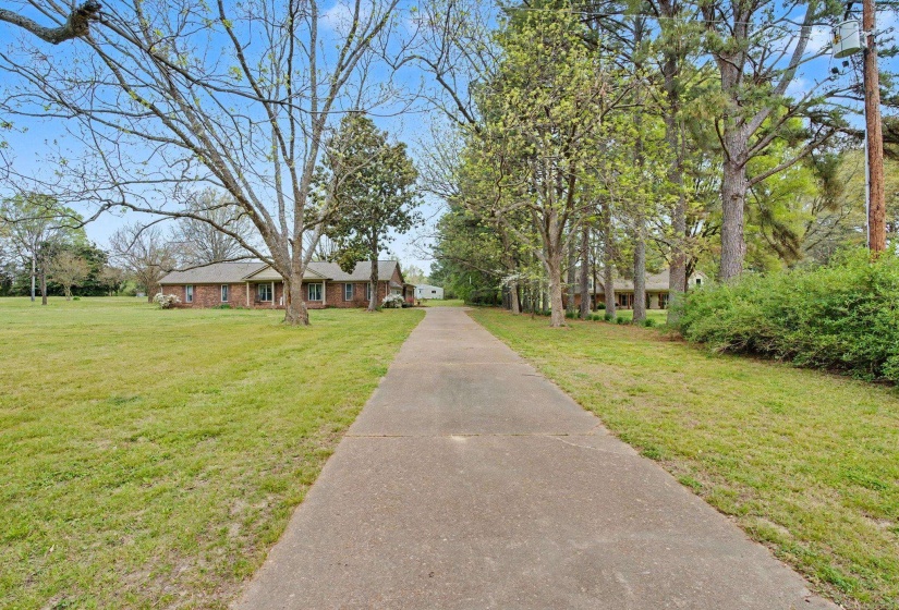 View of front of home featuring a front lawn and brick siding