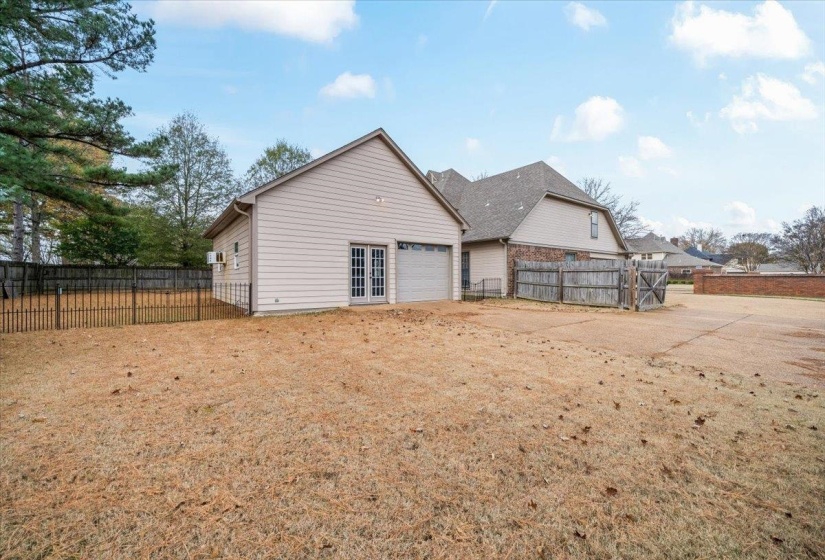 Rear view of property with driveway