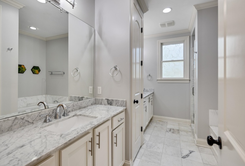 Full bath featuring ornamental molding, vanity, a stall shower, recessed lighting, and a garden tub