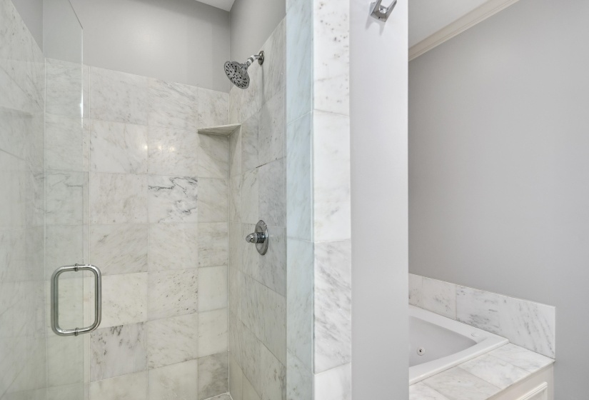 Full bath with a shower stall, a whirlpool tub, and ornamental molding