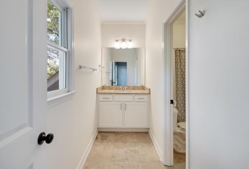 Full bath with vanity, a shower with curtain, and ornamental molding