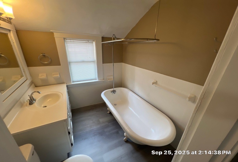 Full bathroom featuring vanity and a soaking tub