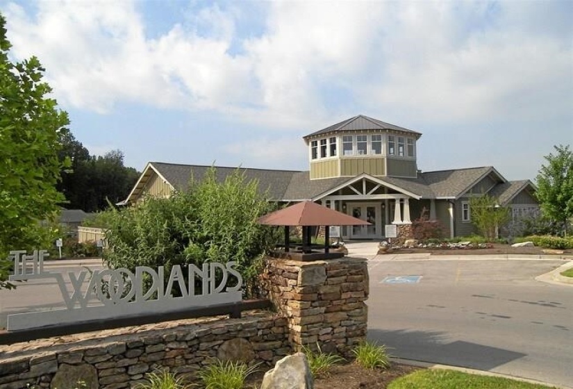 Community sign featuring covered porch