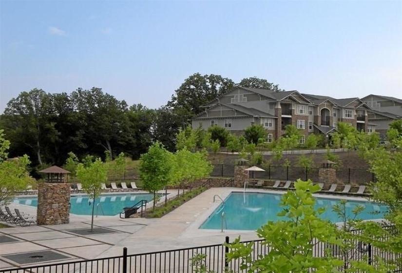 Community pool featuring a patio