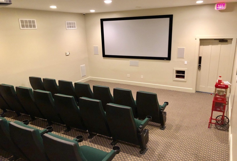 Carpeted cinema room featuring recessed lighting and baseboards