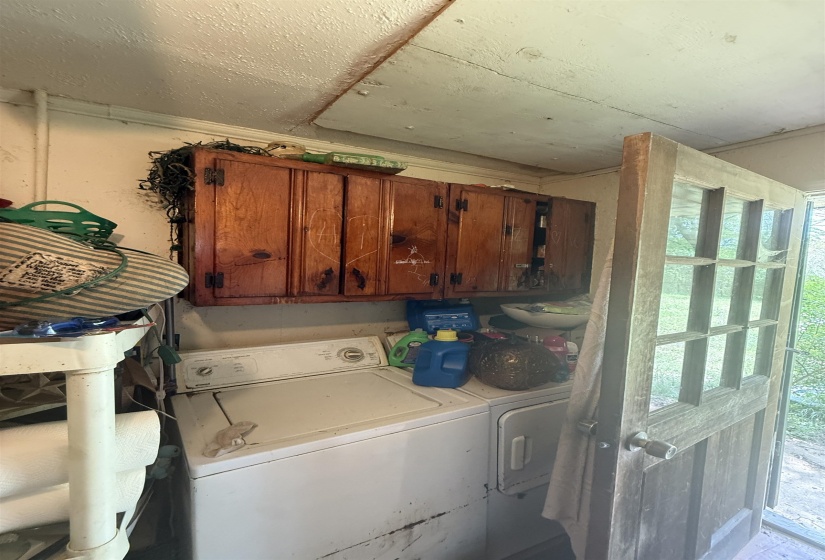 Laundry area with washing machine and clothes dryer and cabinet space