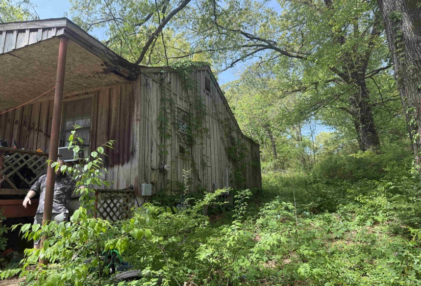 View of home's exterior with a barn