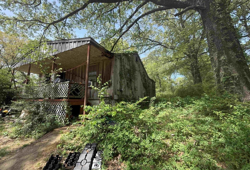 View of side of property featuring a deck