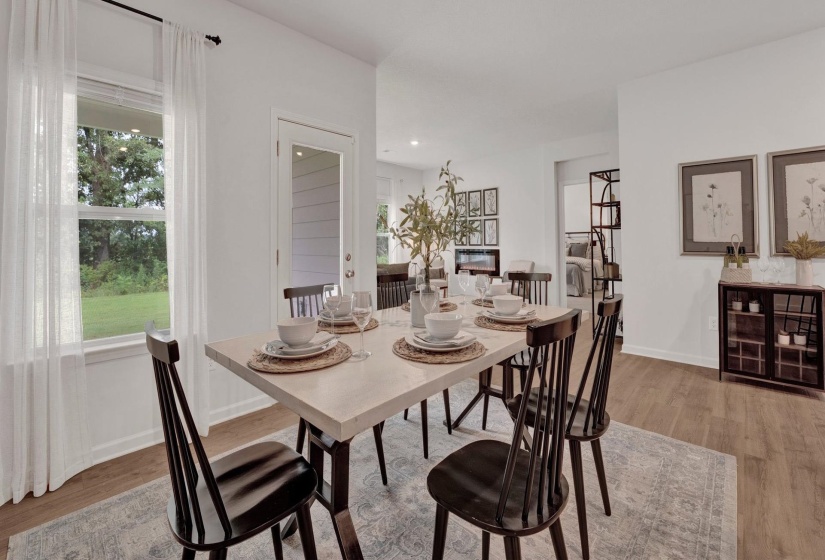 Dining room featuring light wood-style flooring and recessed lighting