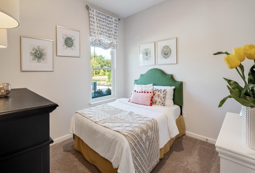 Bedroom with carpet floors and baseboards