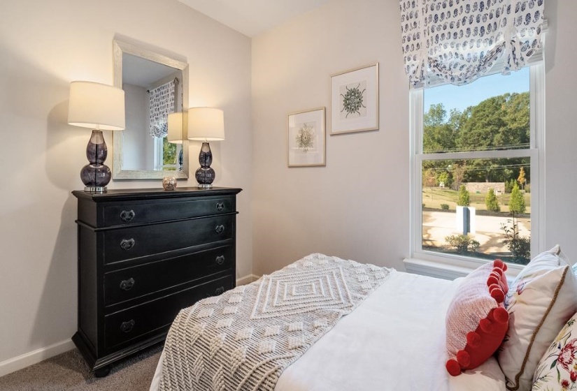 Carpeted bedroom with baseboards