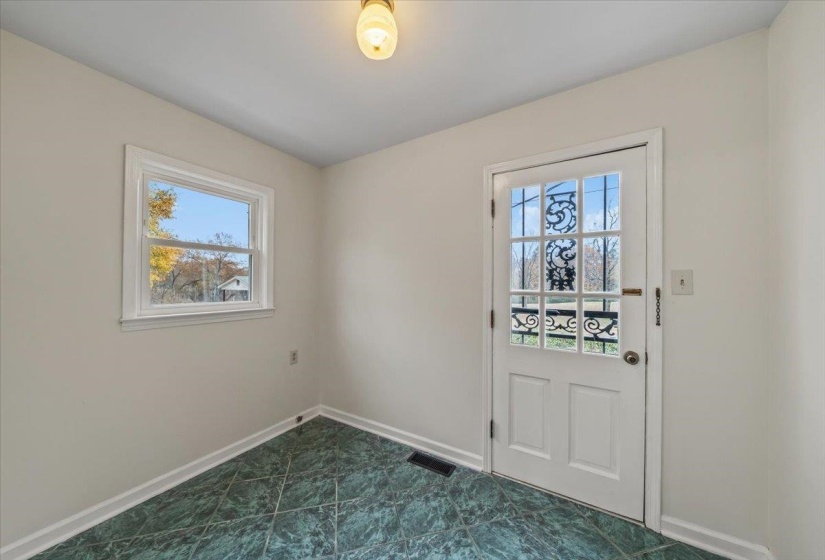 Doorway to outside featuring healthy amount of natural light
