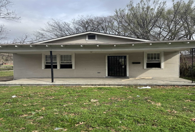 View of front of home with a front yard and a porch