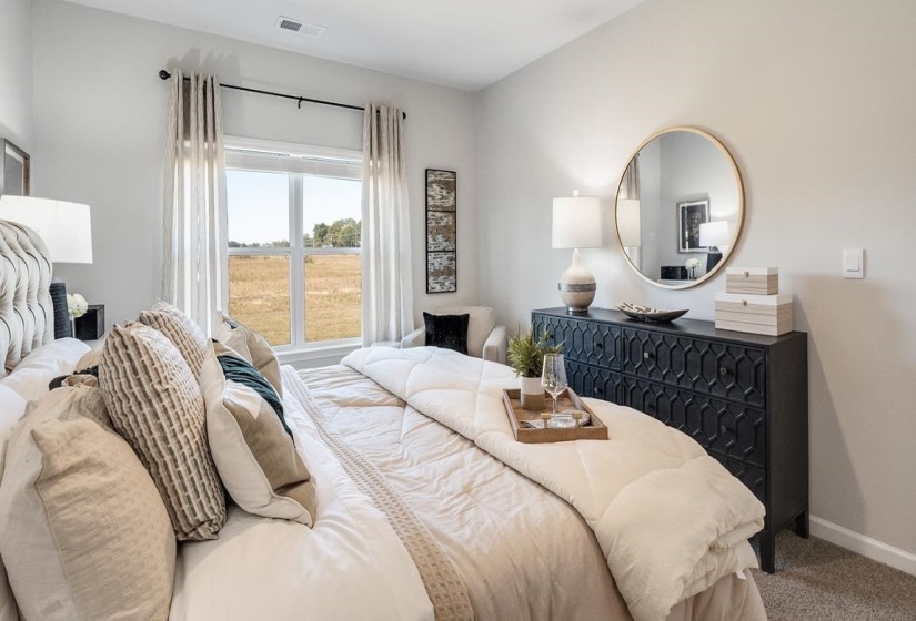 Bedroom with carpet floors and baseboards
