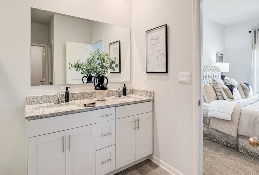Full bathroom with double vanity and ensuite bathroom