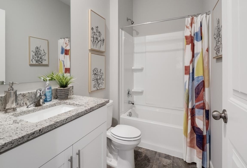 Full bath with vanity and shower / bath combination with curtain