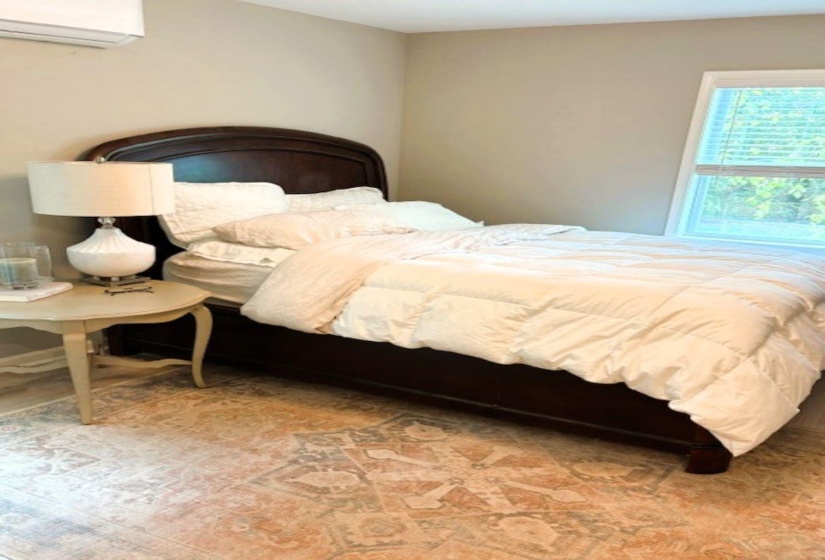 Bedroom with a wall mounted mini split