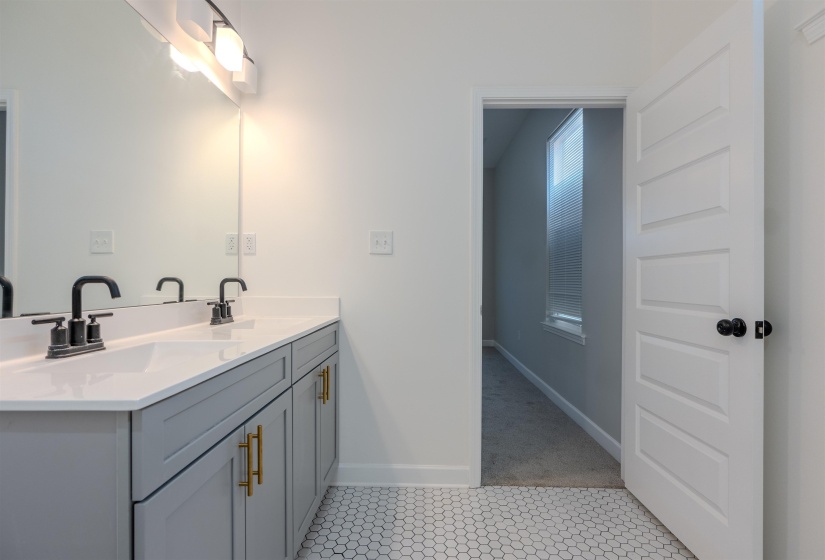 Bathroom with tile patterned flooring and vanity