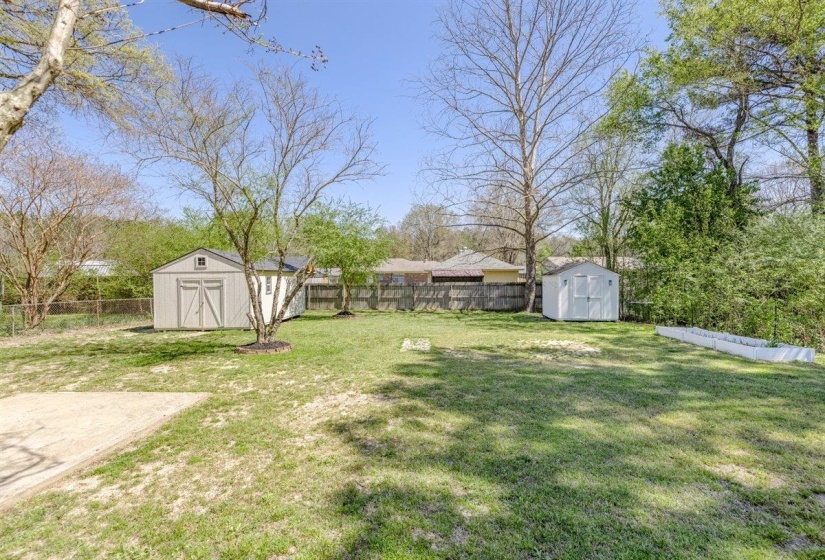 Fenced backyard with a storage unit
