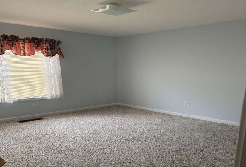 Bedroom with baseboards and carpet floors