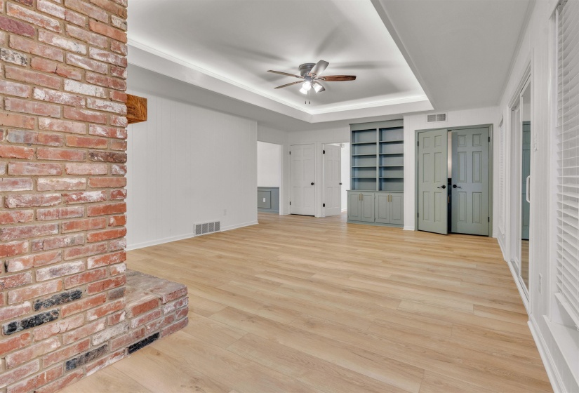 Compete with fireplace, wet bar, and built-ins