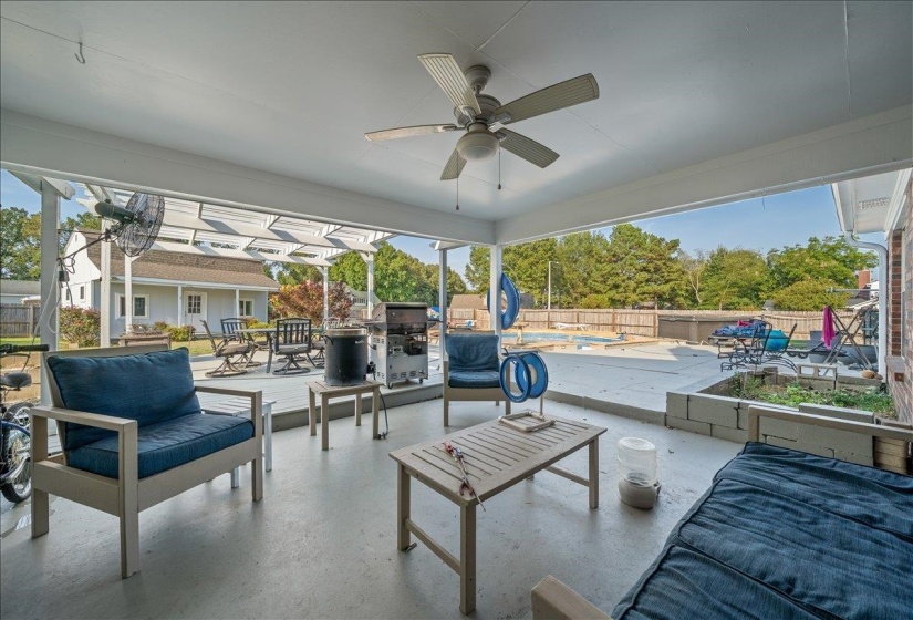 View of patio with an outdoor pool, area for grilling, ceiling fan, and an outdoor living space