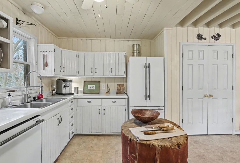 Kitchen with white cabinets, white appliances, light countertops, ceiling fan, and wooden ceiling