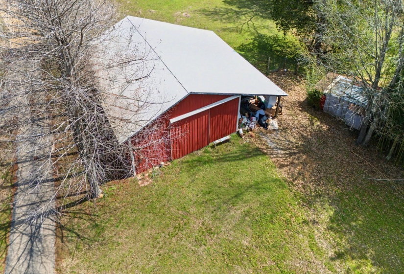 View of green lawn with an outbuilding