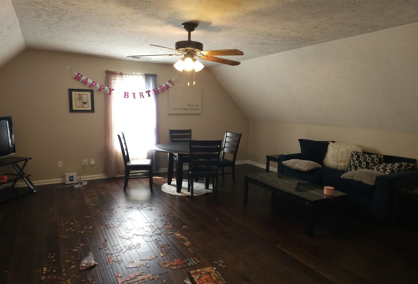Dining area featuring hardwood / wood-style flooring and a ceiling fan