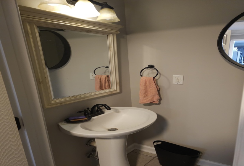 Bathroom featuring baseboards and tile patterned flooring