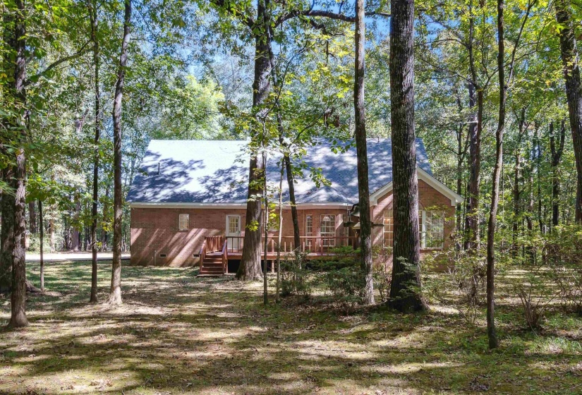Back of house with crawl space and a wooden deck