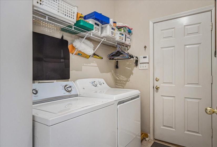 Laundry room featuring washer and clothes dryer
