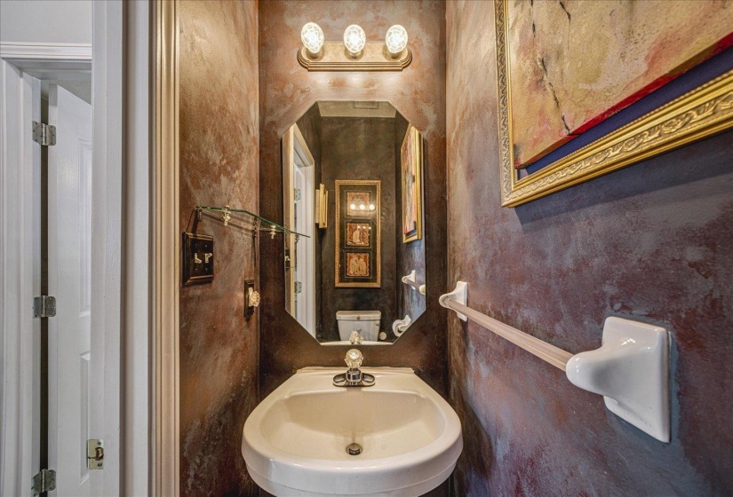 Half bathroom featuring a sink