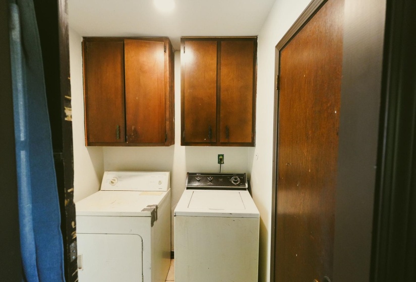 Laundry room featuring cabinet space and washing machine and dryer