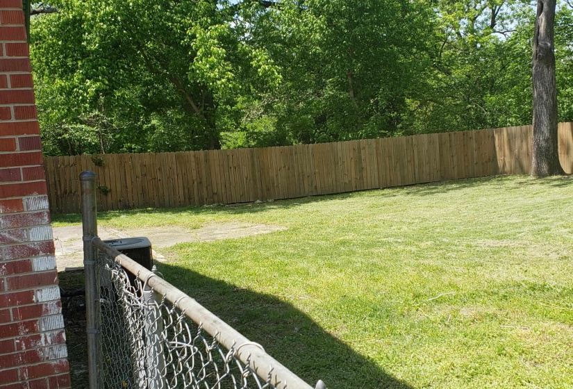 View of fenced backyard