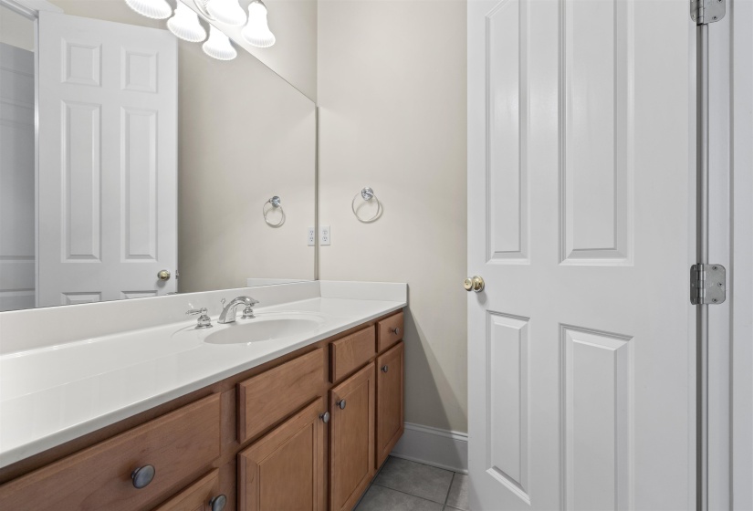 Bathroom featuring vanity and light tile patterned flooring