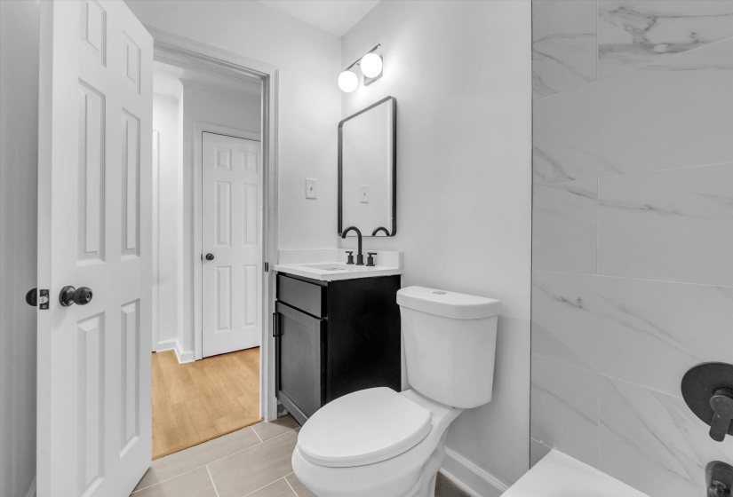 Bathroom featuring vanity and light tile patterned floors