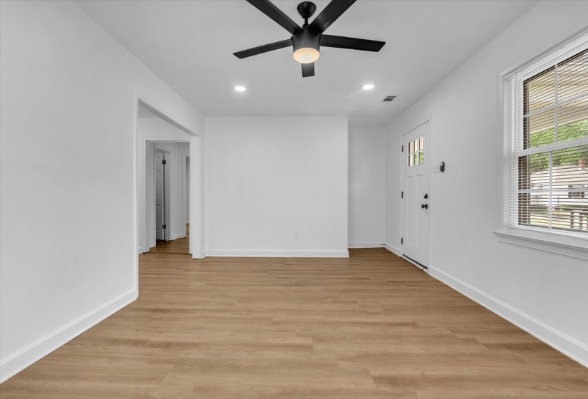 Spare room featuring a ceiling fan, light wood-type flooring, and recessed lighting