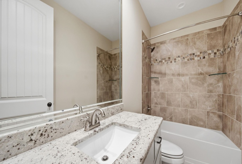 Bathroom featuring vanity and shower / bath combination